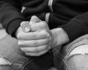 Person in torn jeans