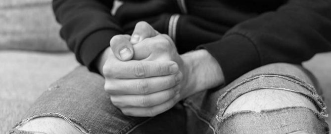 Person in torn jeans